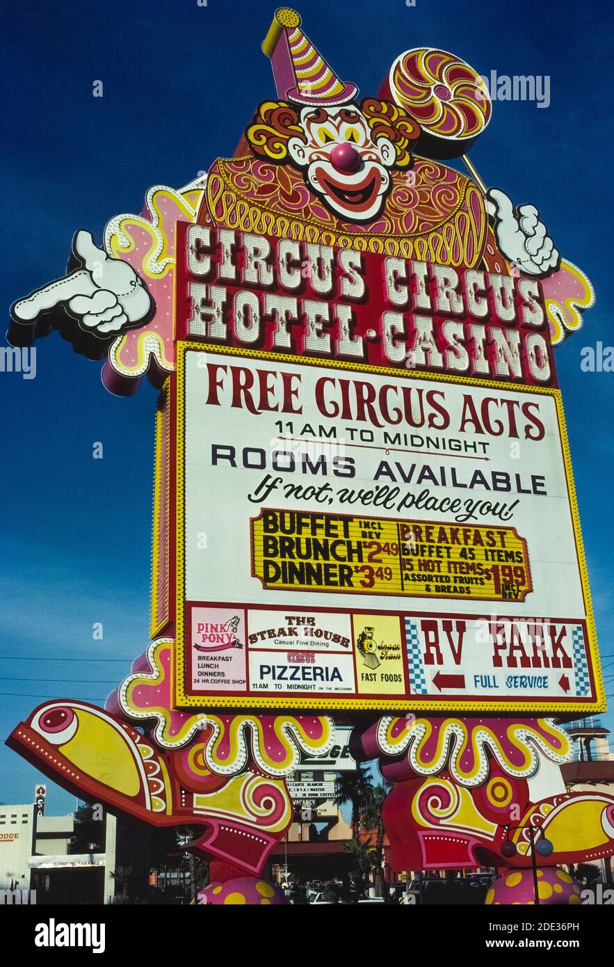 Neon and other lights will make this colorful outdoor sign for the Circus Circus Hotel and Casino stand out at night along Las Vegas Boulevard, better known as the Strip, a roadway lined with spectacular resort hotels and casinos just south of the city limits of Las Vegas, Nevada, USA. Lucky the Clown is the symbol of Circus Circus, which opened in 1968 as the first family-friendly casino in that notorious desert destination best known for its gambling and good times. Children are entertained at this casual resort with circus acts and carnival games. Stock Photo