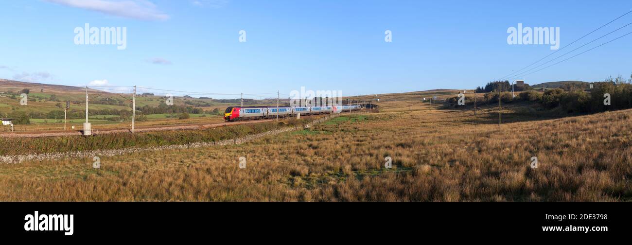 Avanti west coast Bomabrdier voyager diesel trains running on the electrified west coast mainline passing the Cumbrian countryside Stock Photo