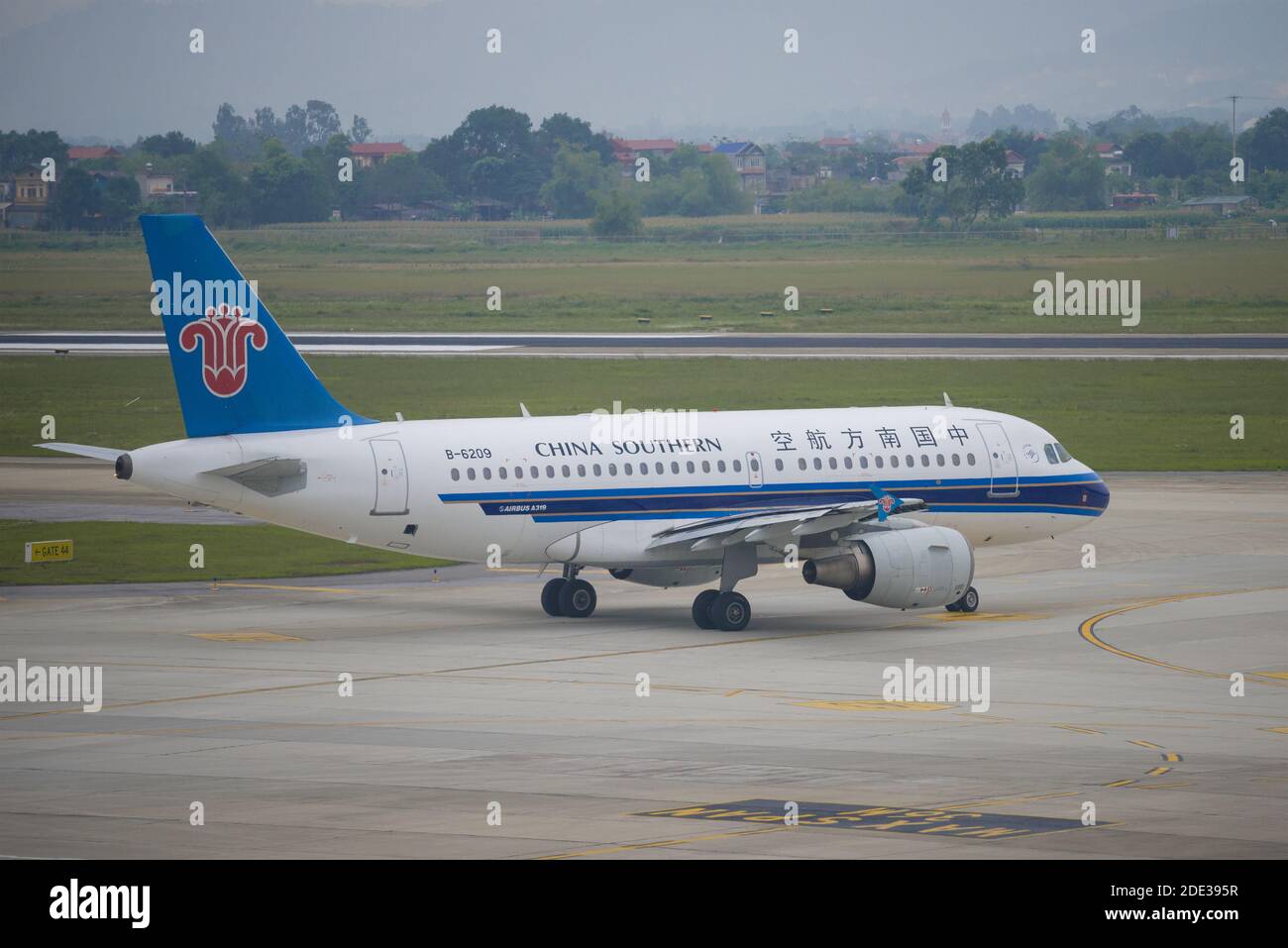 HANOI, VIETNAM - JANUARY 12, 2016: Airbus A319 (B-6209) of China Southern airlines on the Noi Bai airport cloudy morning Stock Photo