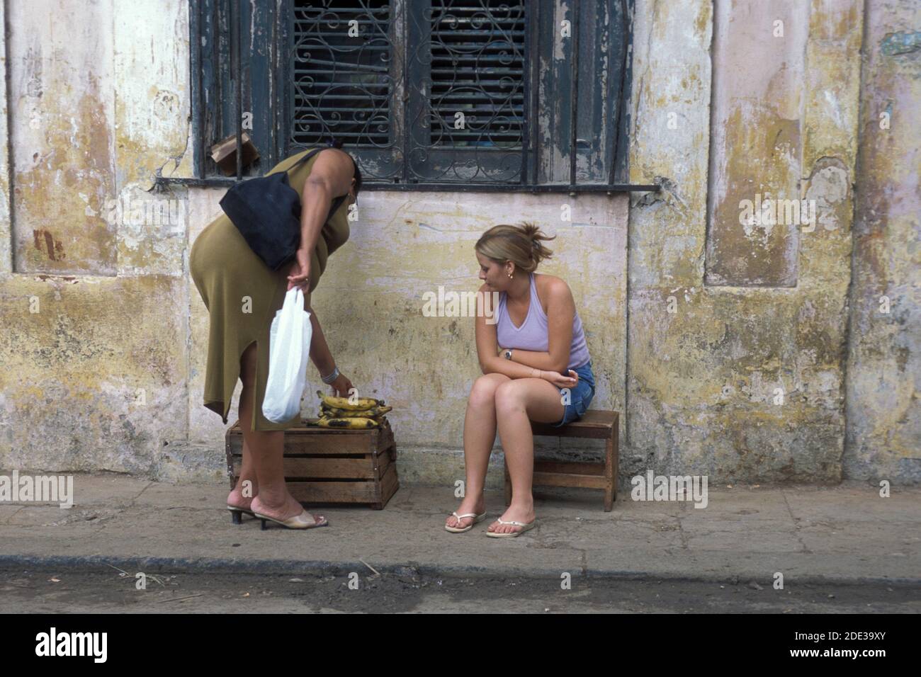 banana seller at a market in the city of Havana on Cuba in the caribbean sea.   Cuba, Havana, October, 2005 Stock Photo