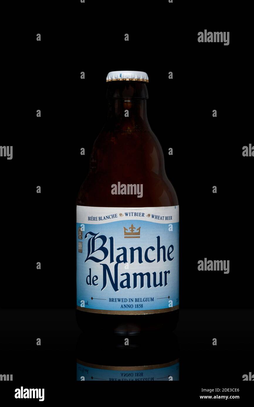 Brussel, Belgium - May 21 2020: Bottle of Belgian beer (Blanche de Namur) isolated on black background. Stock Photo