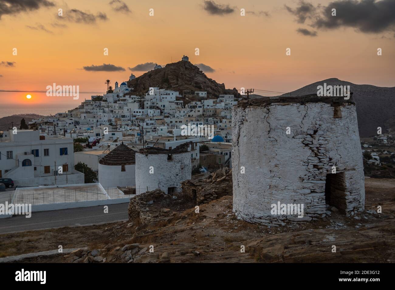 Iconic, traditional windmills on the main square in Chora. Yellow ...