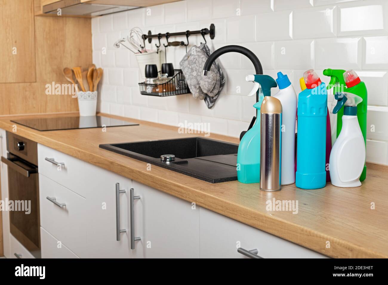 Colorful cleaning products in the kitchen Stock Photo Alamy