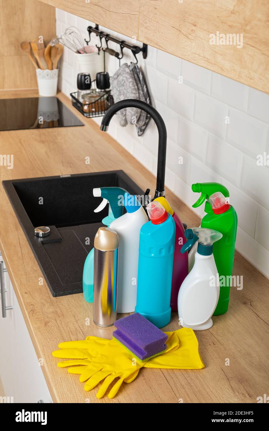 Colorful cleaning products in the kitchen Stock Photo Alamy