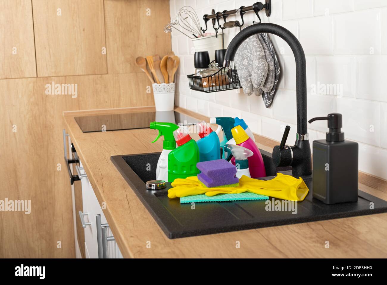 Colorful cleaning products in the kitchen Stock Photo Alamy
