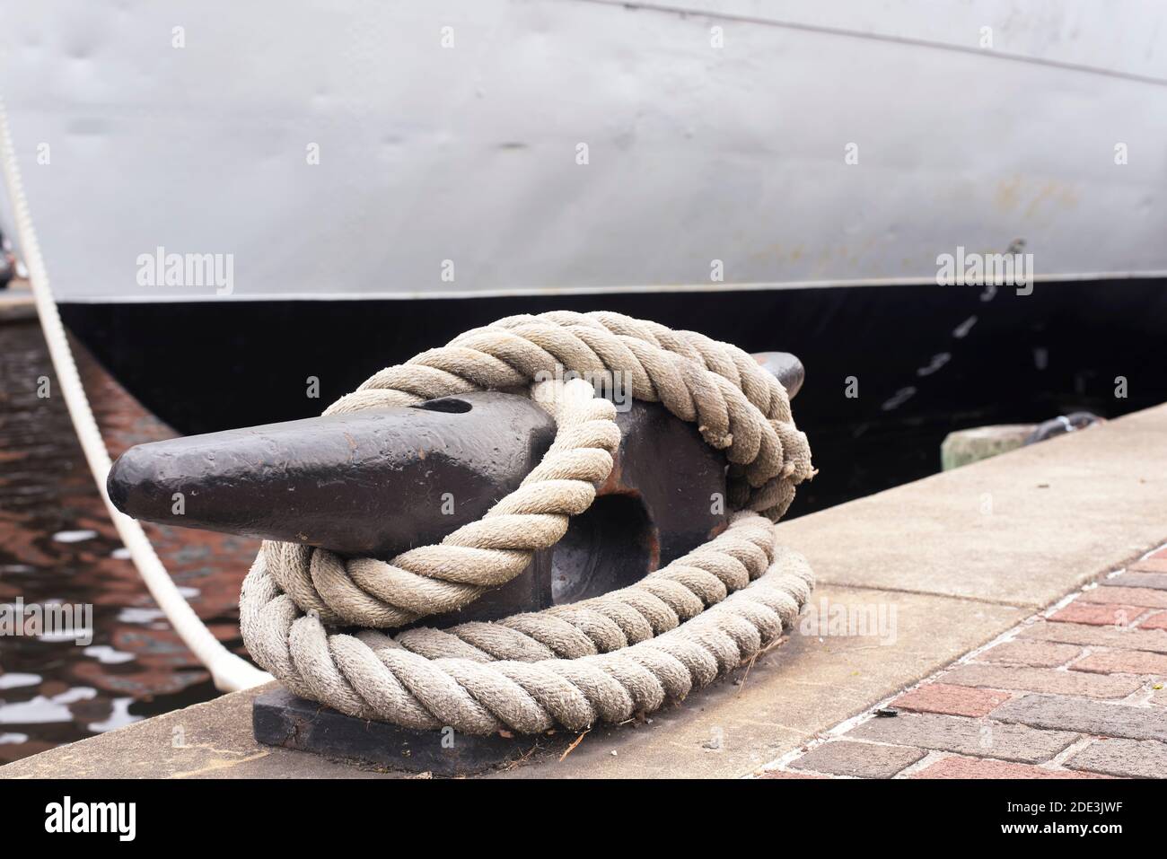 Large rope tied off from a ship docked on pier 5 at the inner