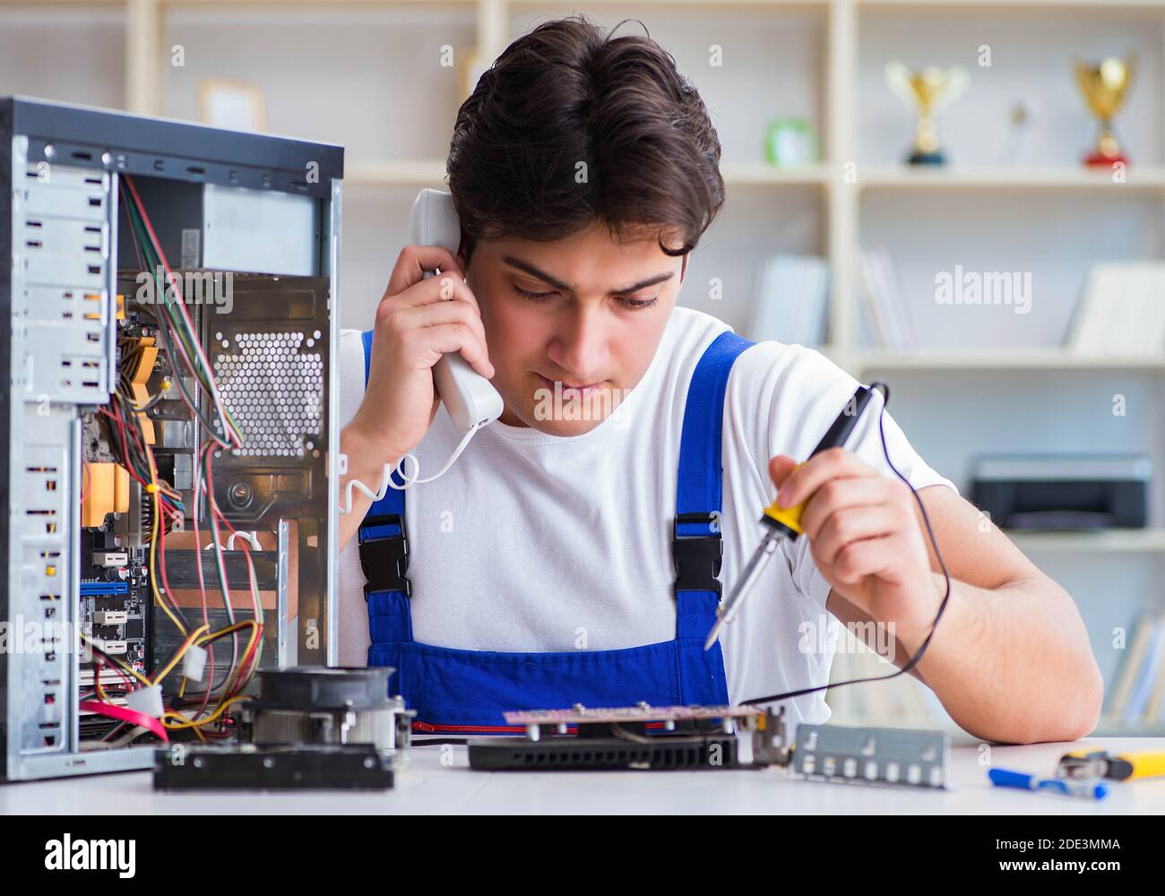 The computer repairman repairing desktop computer Stock Photo - Alamy