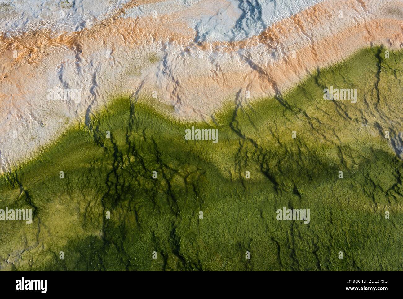 From above drone view of amazing colorful rocky terrain with mountains on sunny day Stock Photo