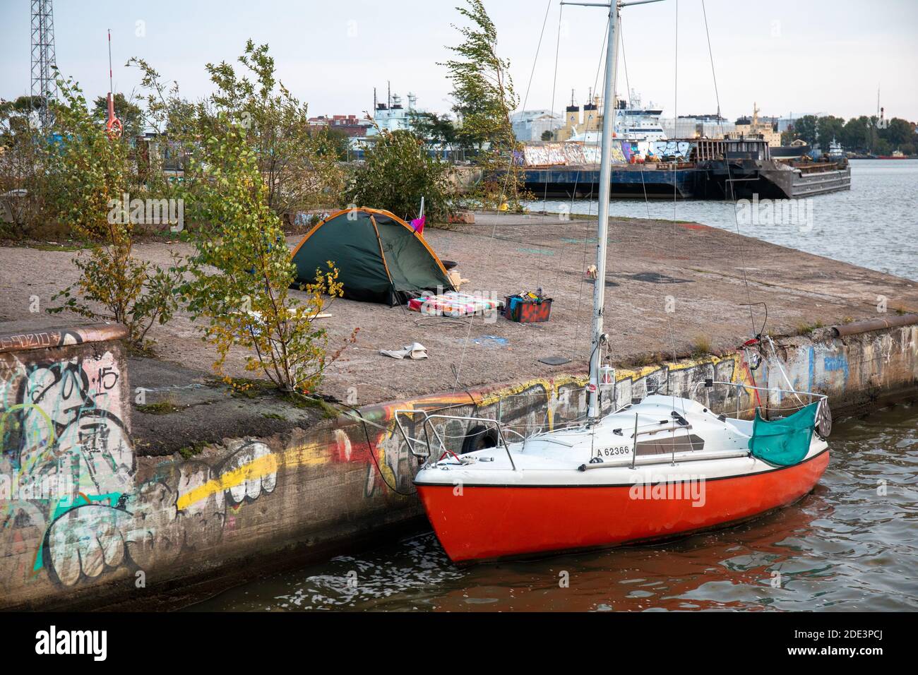 Camping tent and a sailboat in Sompasaari wasteland in Helsinki, Finland Stock Photo