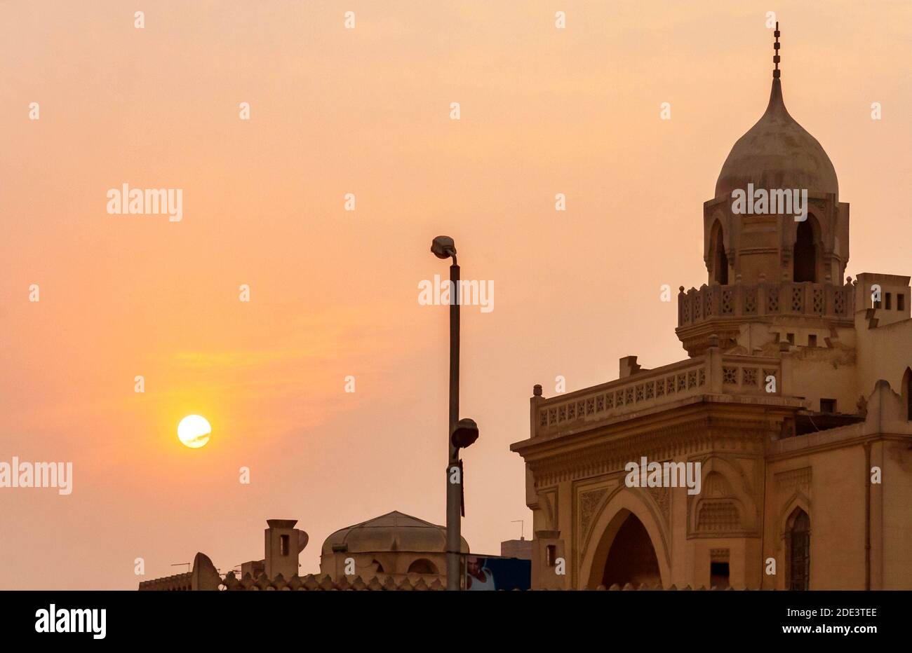 Sunset in Cairo over an ancient Islamic building Stock Photo