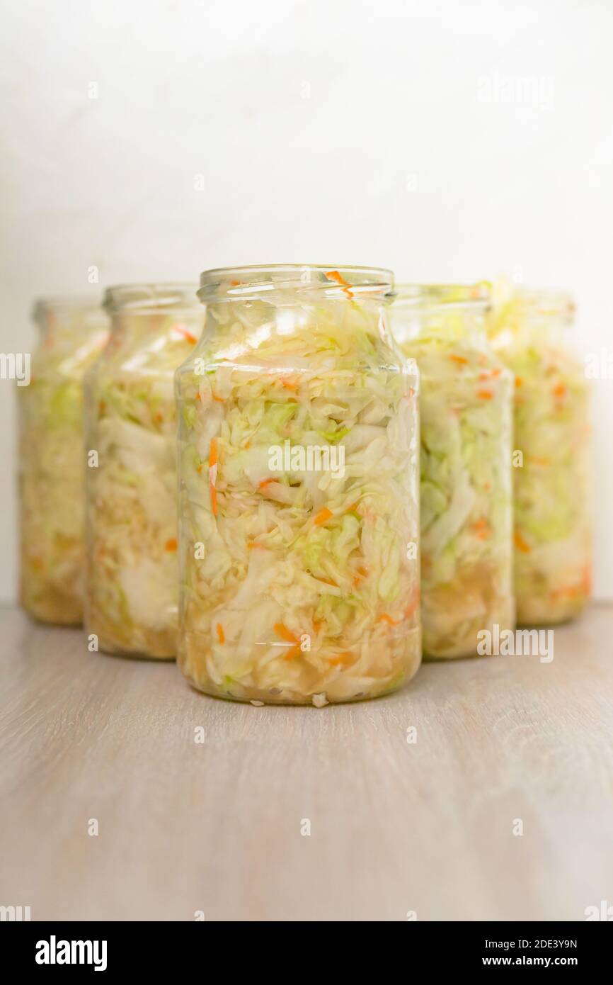 Sauerkraut fermentation in glass can. Cut white cabbage fermented by