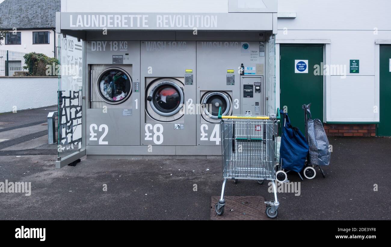 Laundrette Revolution outside Morrisons supermarket Stock Photo