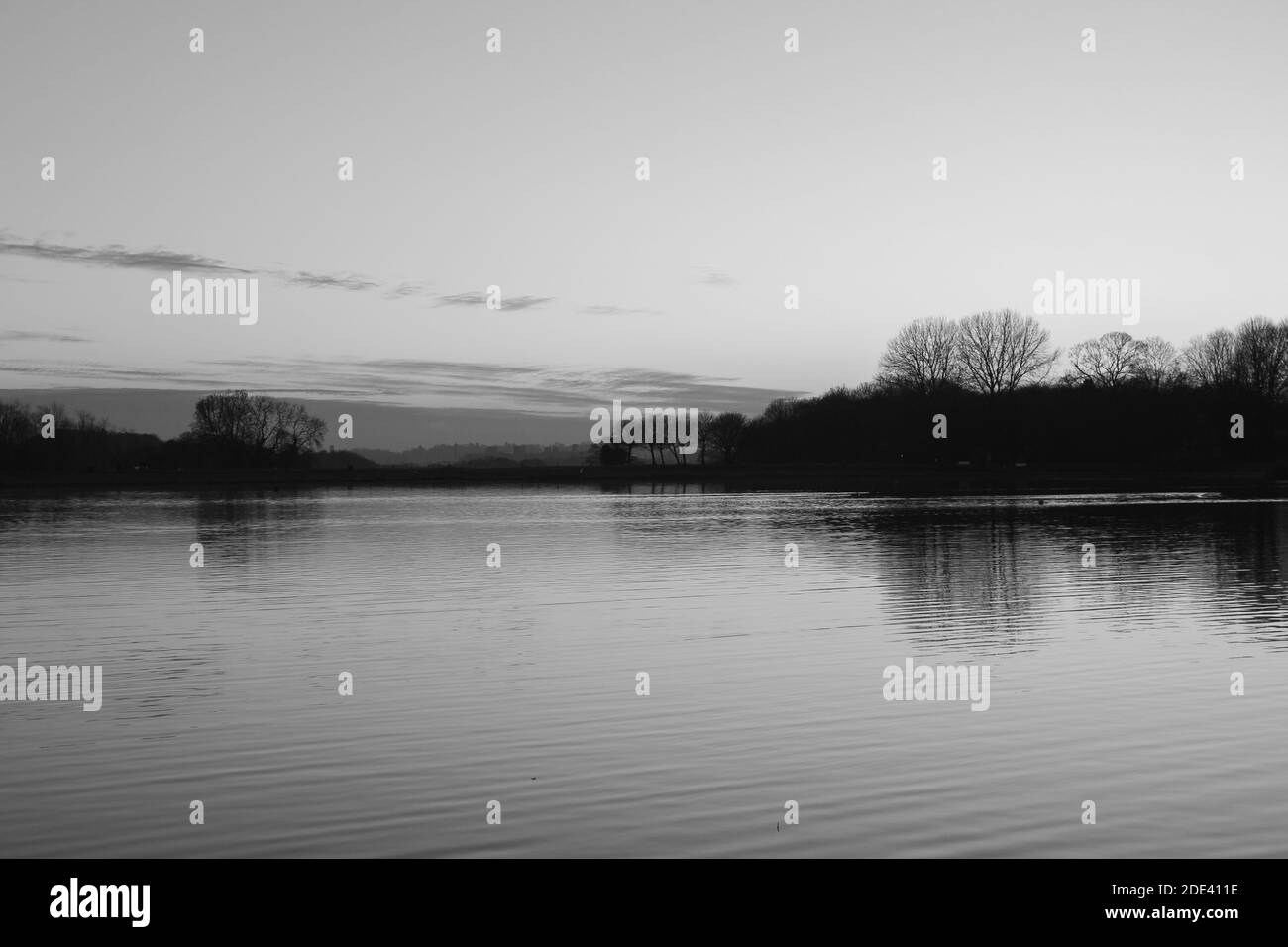 Sunset colors on lake Black and White Stock Photos & Images - Alamy