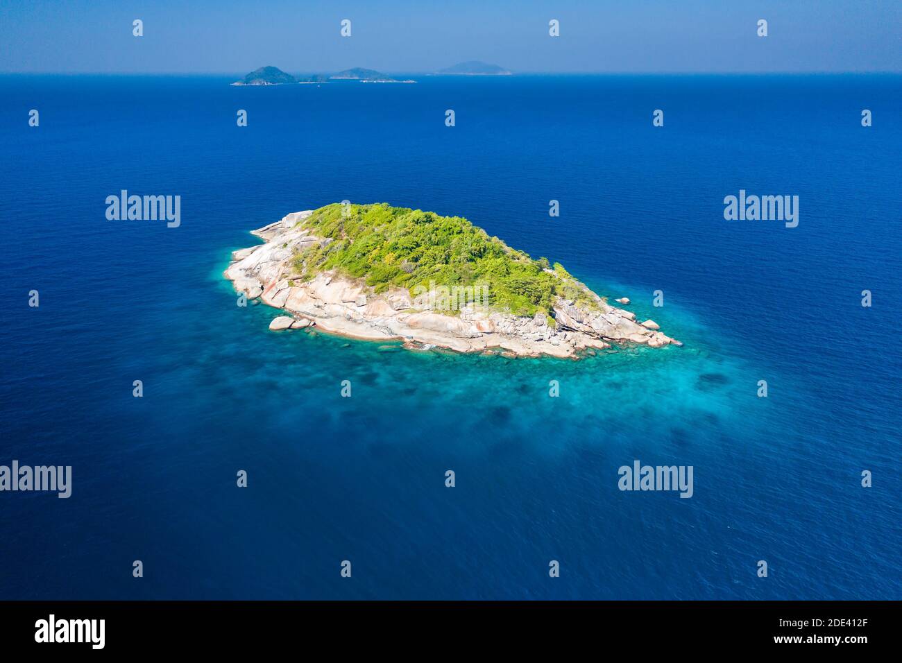 Aerial view of a remote, tiny tropical island in a clear, warm ocean (Andaman Sea) Stock Photo