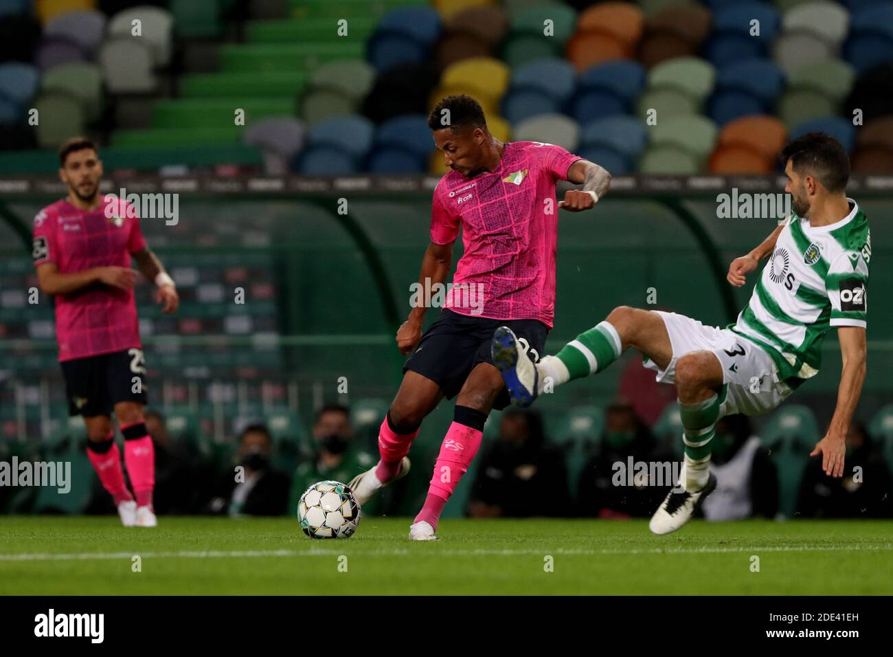 Lisbon, Portugal. 28th Nov, 2020. Walterson Silva of Moreirense FC (C ) vies with Luis Neto of Sporting CP during the Portuguese League football match between Sporting CP and Moreirense FC at Jose Alvalade stadium in Lisbon, Portugal on November 28, 2020. Credit: Pedro Fiuza/ZUMA Wire/Alamy Live News Stock Photo