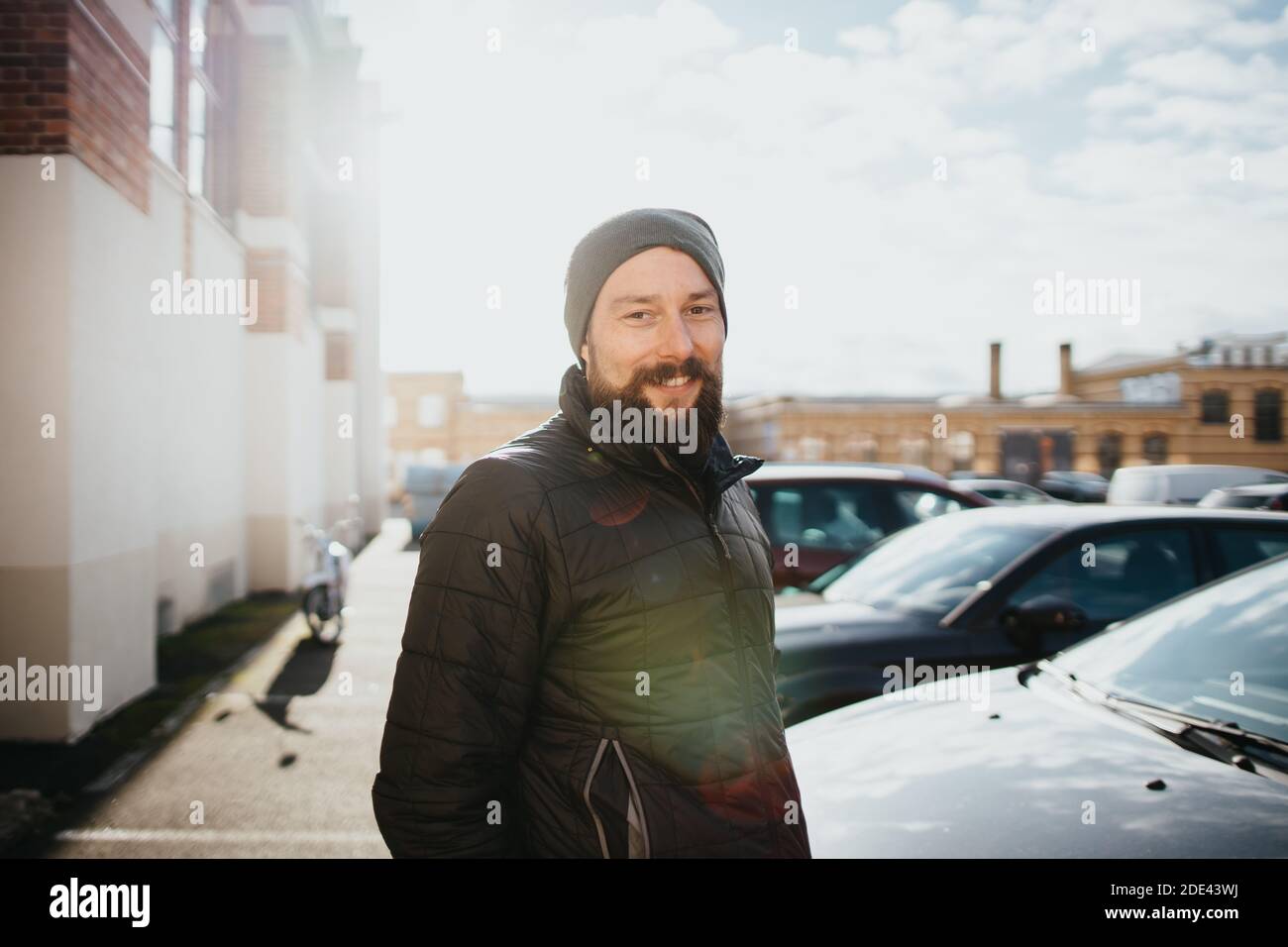 smiling bearded man dressed in winter clothes Stock Photo