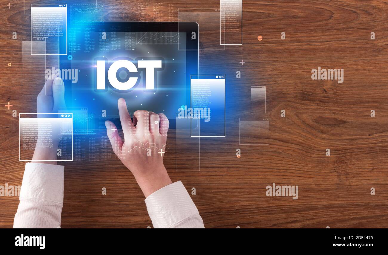 Close-up of a hand holding tablet with ICT abbreviation, modern ...