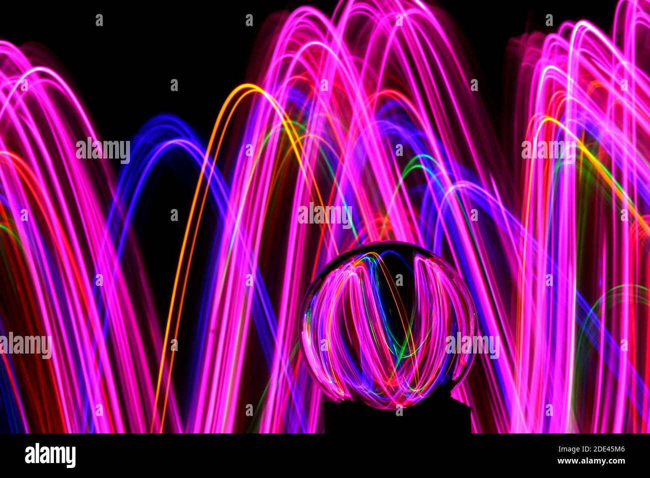 Long exposure photograph of neon multi colour in an abstract swirl ...