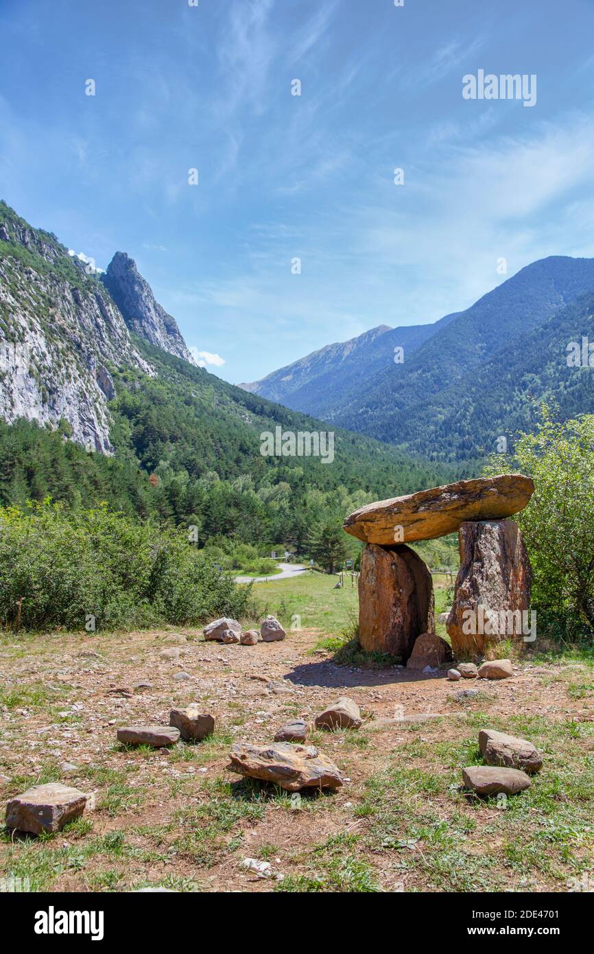 Megalithic dolmen of Santa Elena in a mountain landscape in the Pyrenees, Biescas, Tena Valley Huesca , Spain, vertical Stock Photo