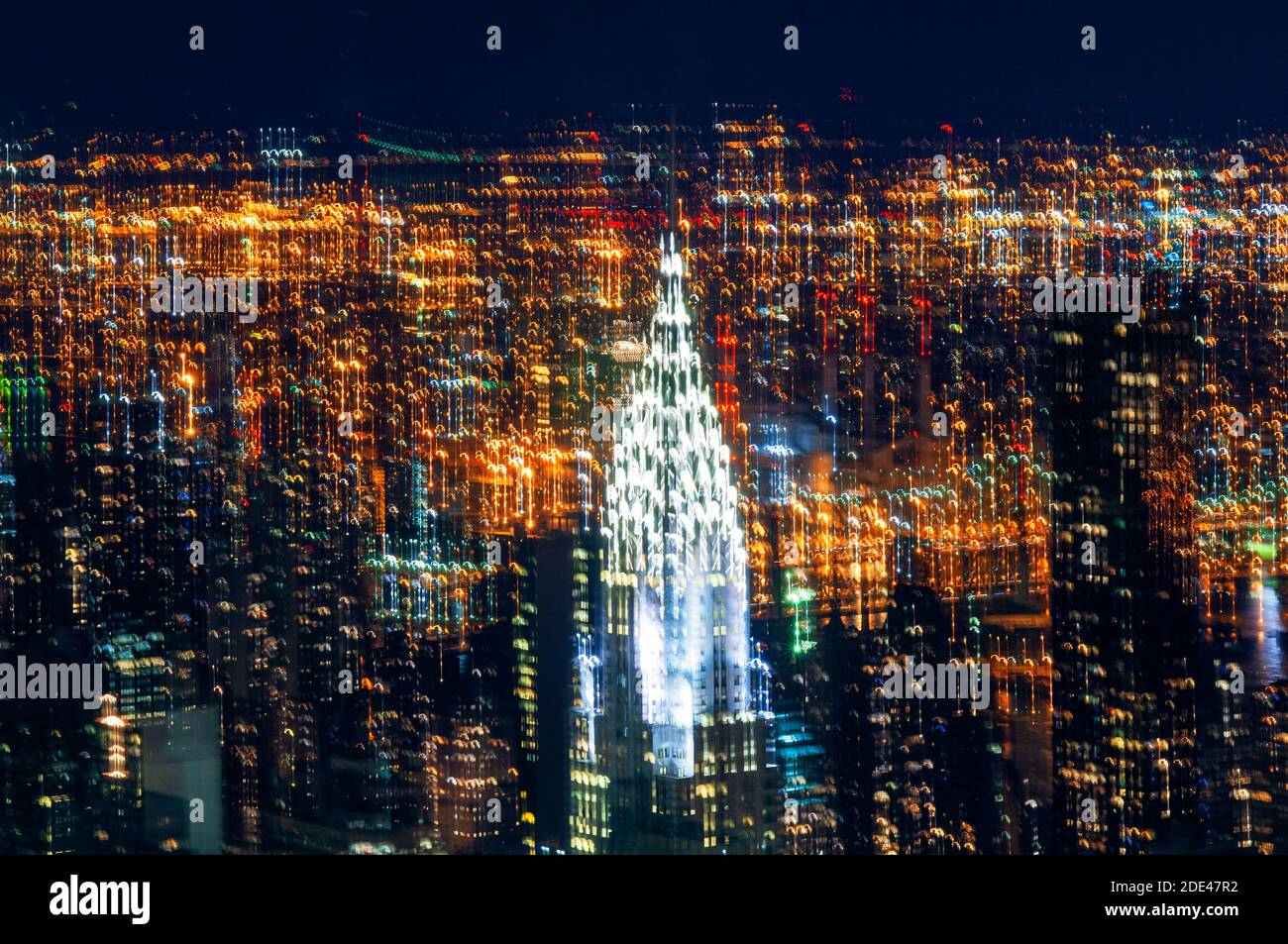 Aerial view  from the Empire State building. Night view of Lower Midtown with Metlife Building and the Chrysler Building in height projecting other im Stock Photo