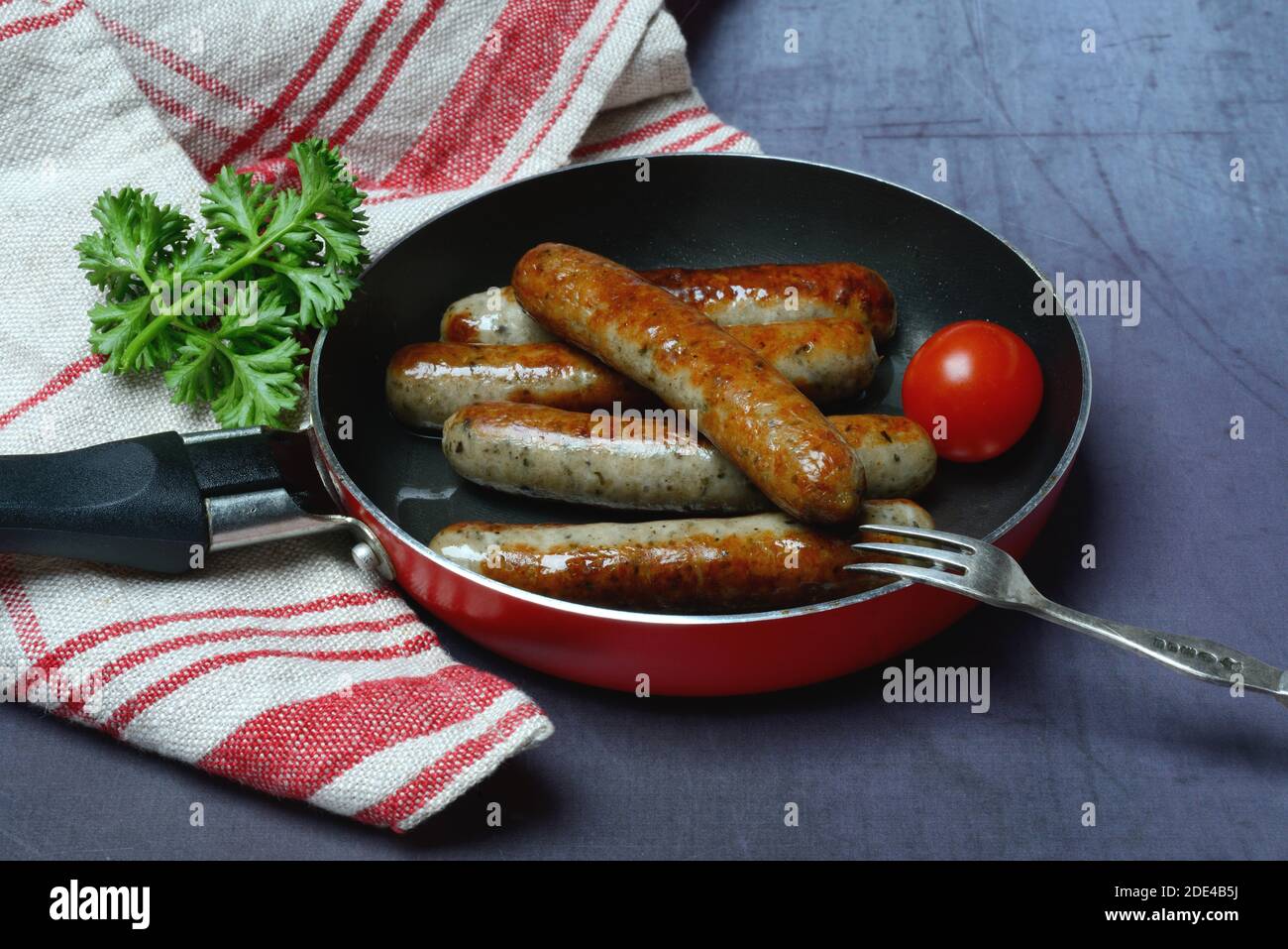 Nuremberger Rostbratwurstchen in pan, roasted, Germany Stock Photo