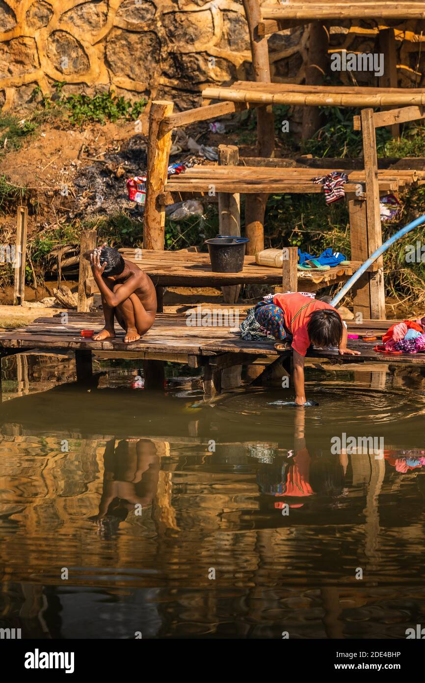 Children washing in the river, lake Inle, Myanmar Stock Photo