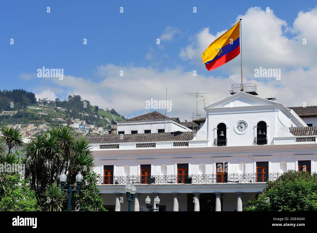 Waving national flag over the seat of government Palacio de Carondelet