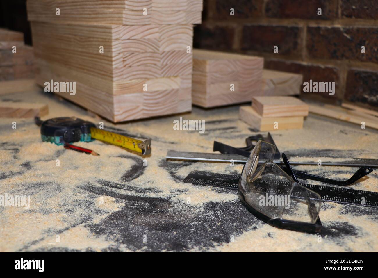 Safety Glasses And Equipment On Dusty Carpentry Bench Stock Photo Alamy