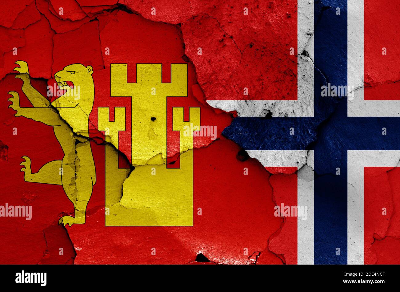 flags of Fredrikstad and Norway painted on cracked wall Stock Photo