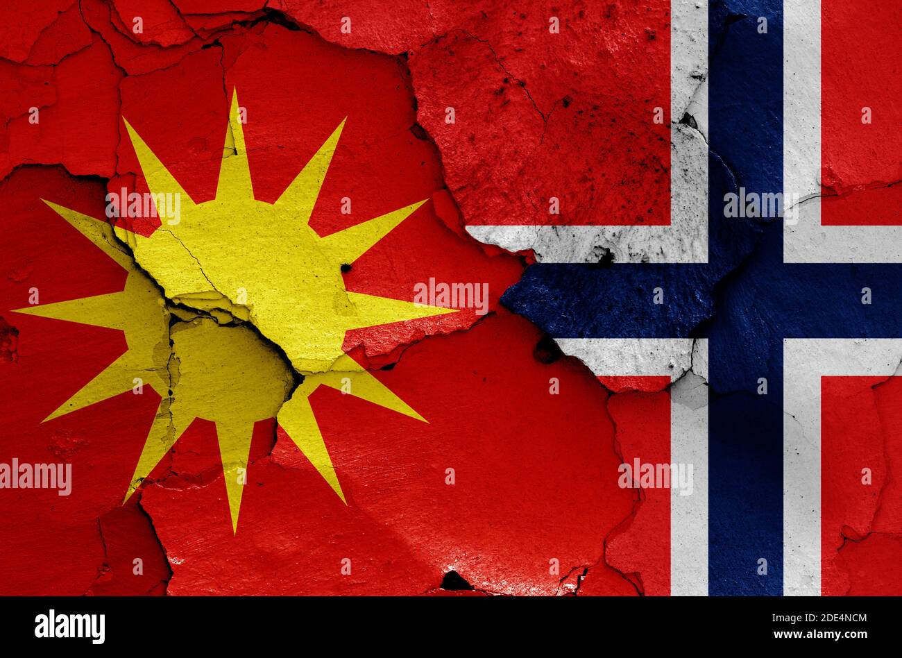 flags of Bodo and Norway painted on cracked wall Stock Photo