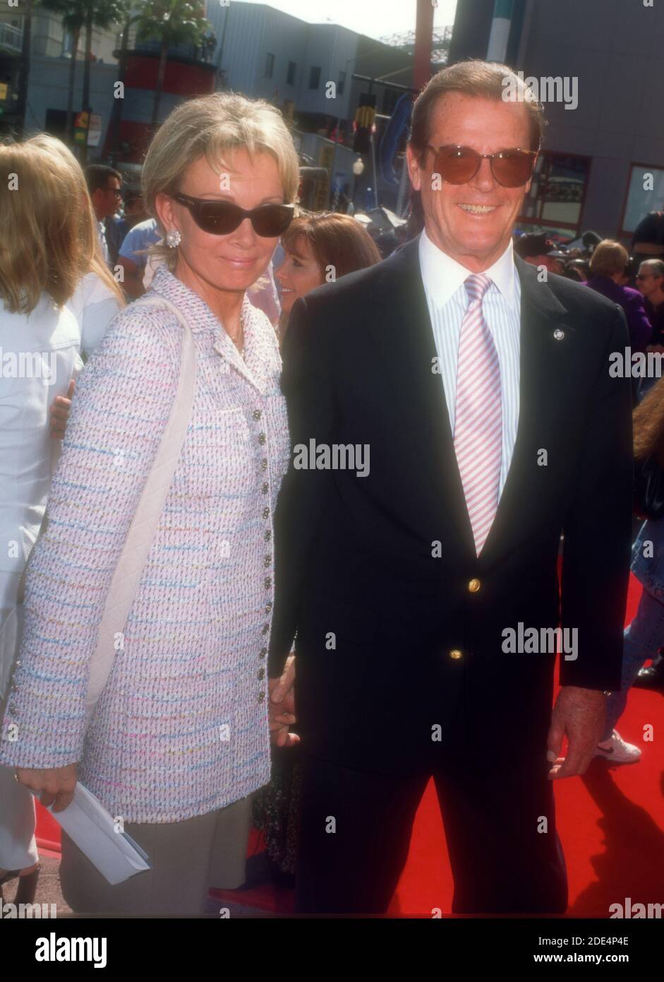 Universal City, California, USA 20th April 1996 Actress Luisa Mattioli and husband actor Roger Moore attend Universal Pictures' 'The Quest' on April 20, 1996 at Cineplex Odeon Universal City Cinemas in Universal City, California, USA. Photo by Barry King/Alamy Stock Photo Stock Photo