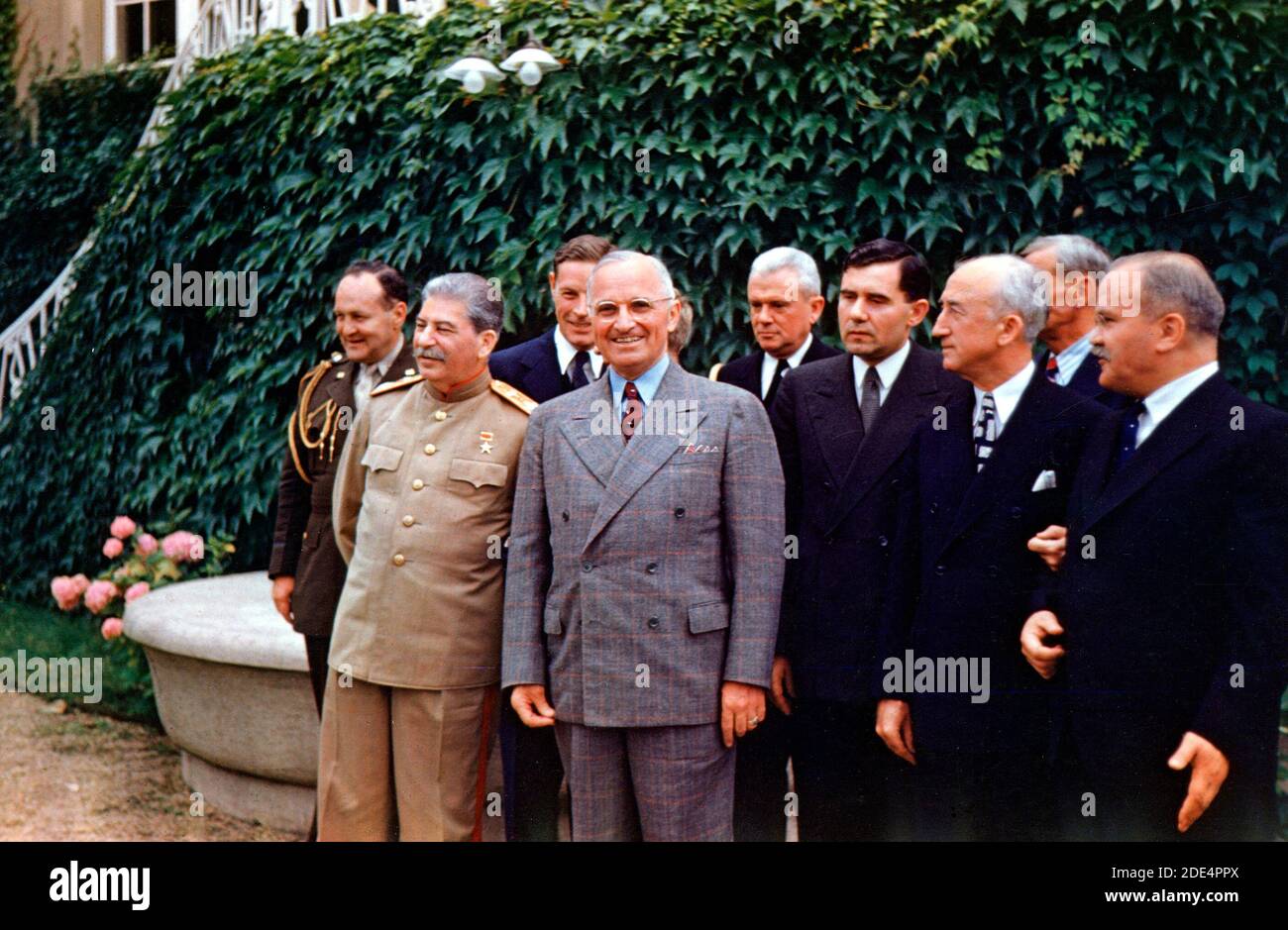 Harry S. Truman and Joseph Stalin meeting at Potsdam. From left to right, row 1 : Joseph Stalin, Harry S. Truman, Soviet Ambassador Andrei Gromyko, Secretary of State James Byrnes, and Soviet Foreign Minister Vyacheslav Molotov. Second row: General Harry Vaughan, interpreter Charles Bohlen, interpreter V. N. Pavlov (mostly obscured by Truman), Captain James K. Vardaman, and Charles Ross (partially obscured), 18 July 1945 Stock Photo