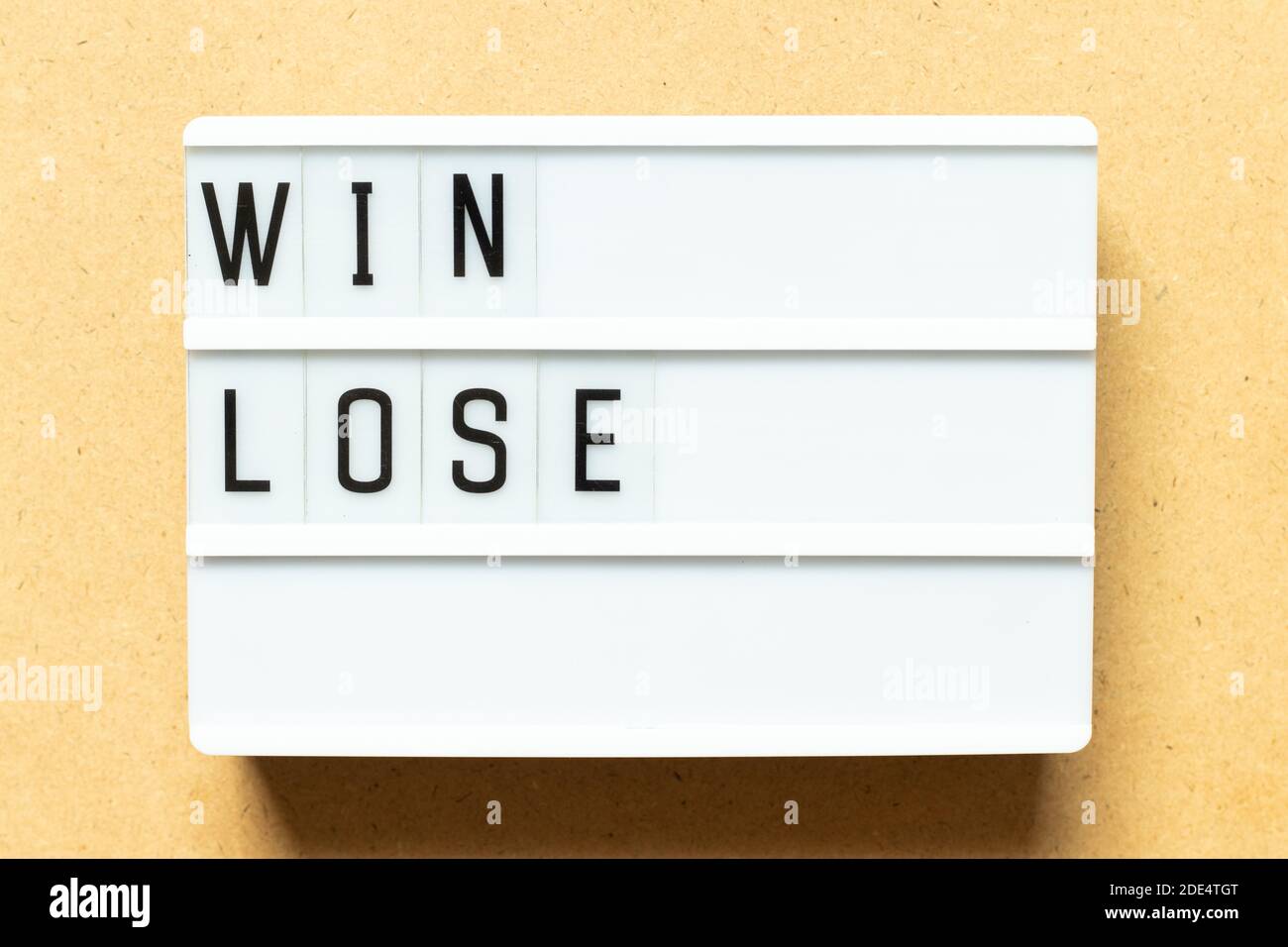 Lightbox with word win lose on wood background Stock Photo