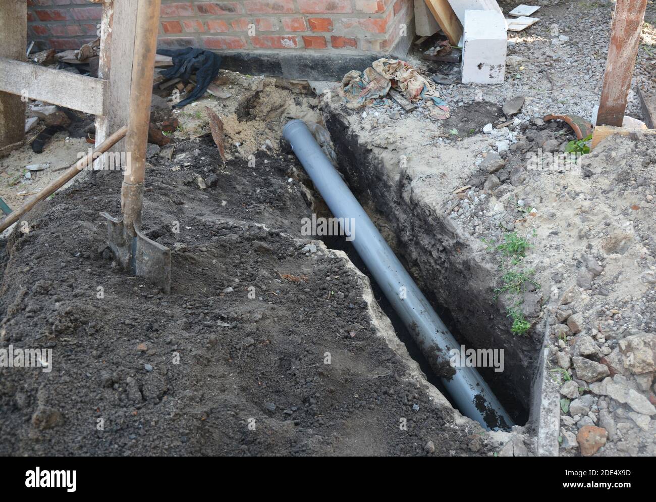 Installing sewer pipe in the ground trench Stock Photo Alamy