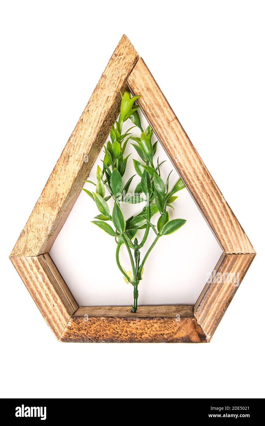 wooden hexagonal wall decorative frame with an artificial flower in the
