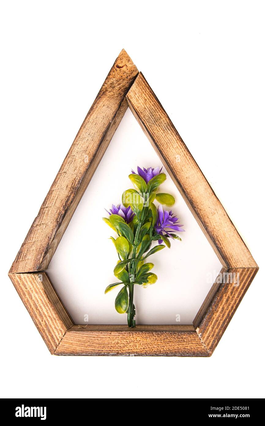 wooden hexagonal wall decorative frame with an artificial flower in the