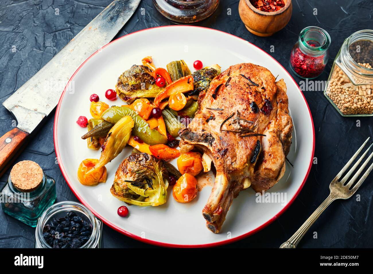 Grilled roasted rack of pork on plate.Baked meat with different