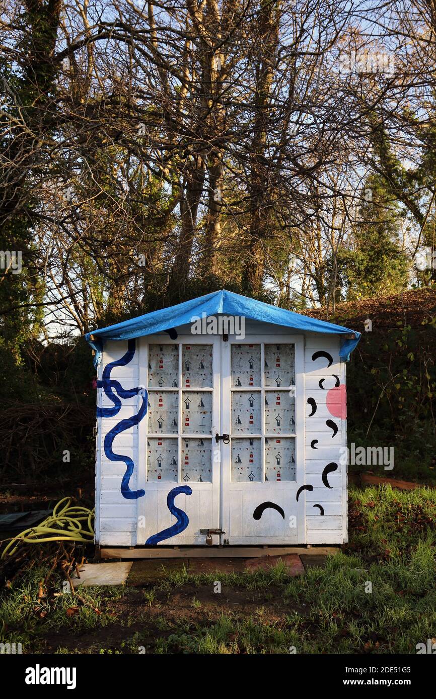 Blue and white painted shed on an allotment Stock Photo