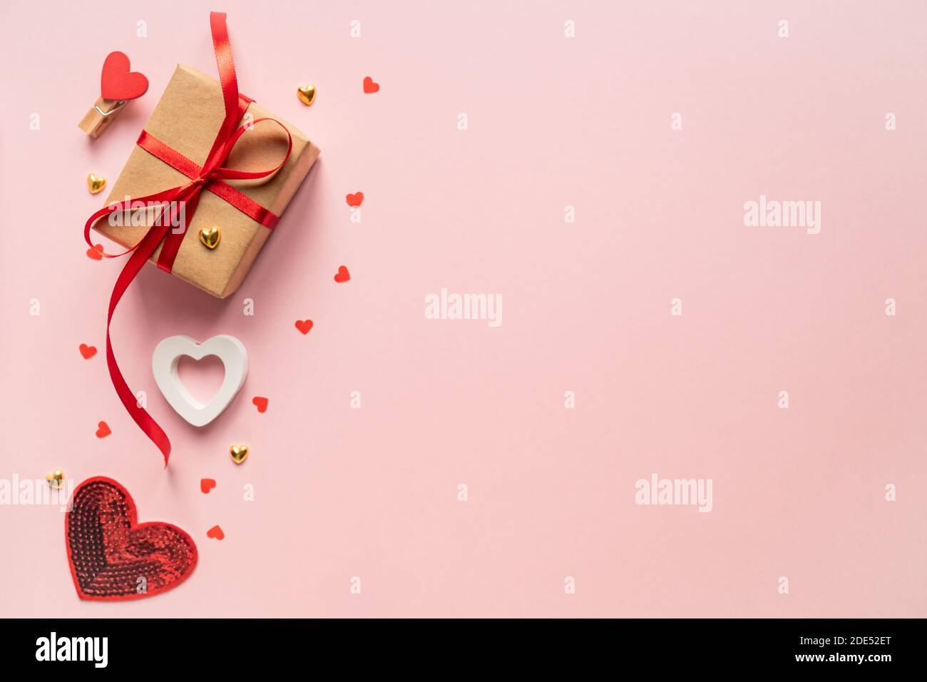 Paper craft Gift box with red ribbon bow and red hearts. Festive ...