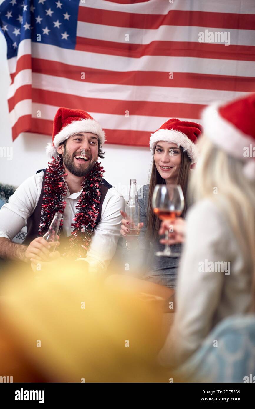 A group of cheerful friends and Xmas celebration at home in holiday atmosphere. Christmas, friendship, together Stock Photo