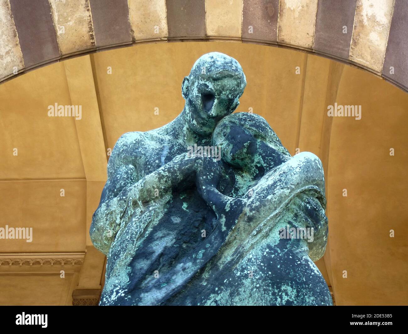 Old love never dies corroded statue at Cimitero Monumentale in Milan