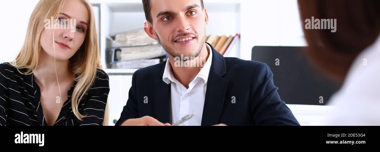 Attractive young woman looking straight at camera Stock Photo