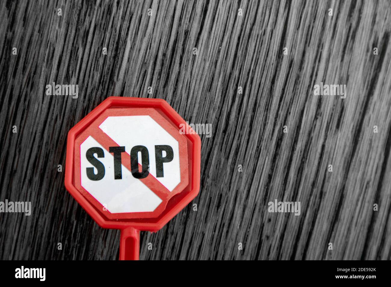 Isolated plastic toy warning sign - STOP. Danger ahead, do not enter, forbidden, construction sight, road sign, signpost concept background. Isolated Stock Photo