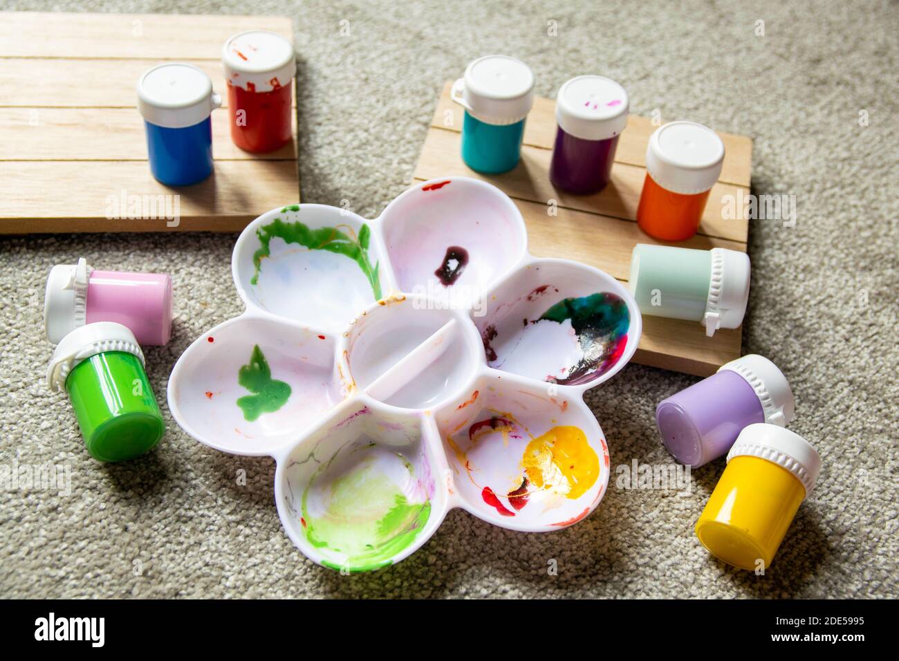 Various children's paint pots with mixing tray. Family fun activity to