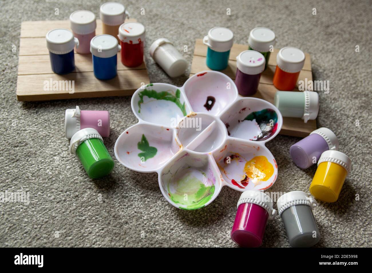 Various children's paint pots with mixing tray. Family fun activity to