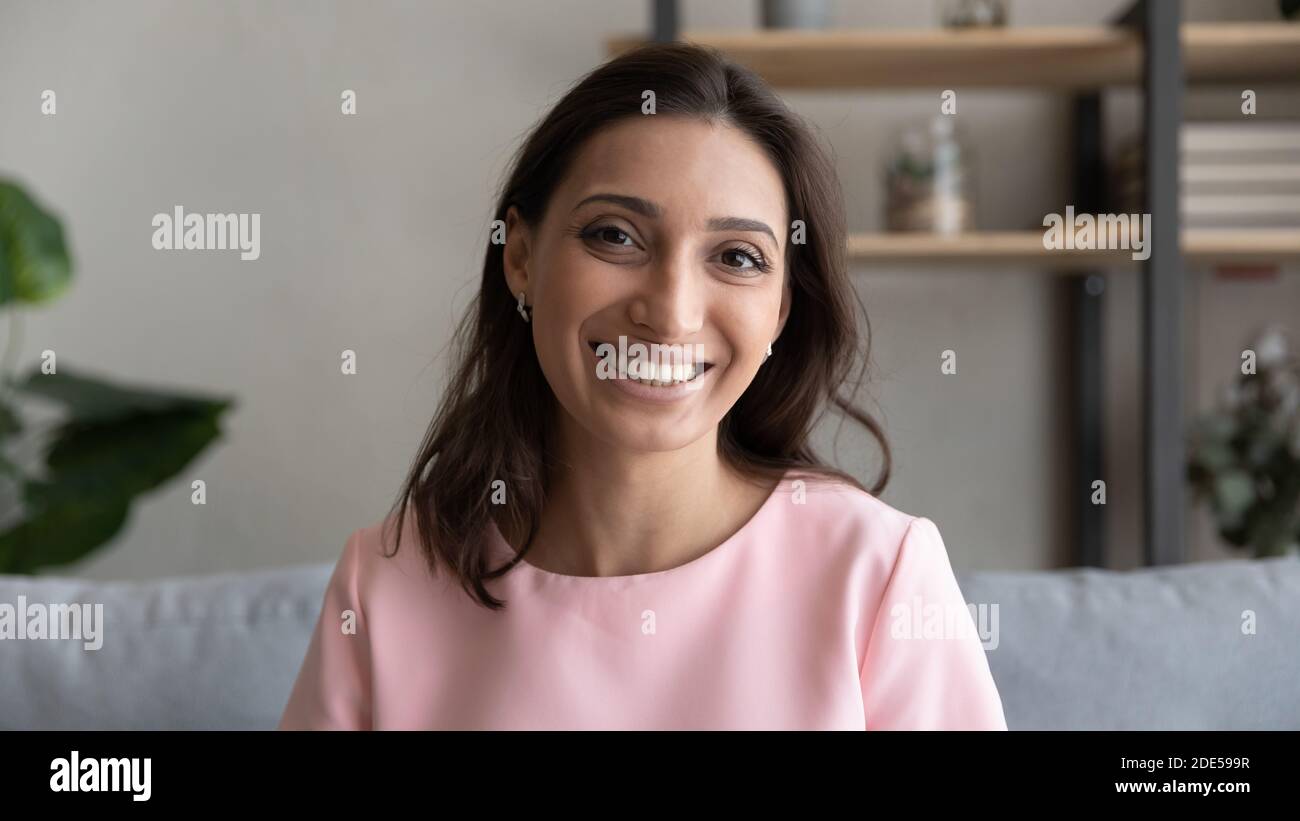 Smiling mixed race arab indian woman looking at camera Stock Photo Alamy