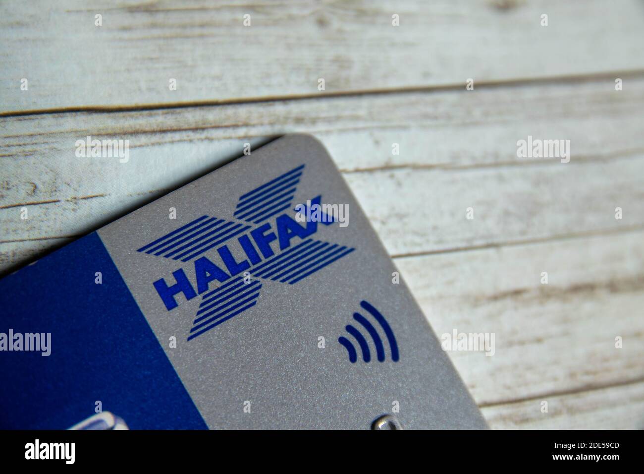 Durham, UK - 7 May 20: Plastic contactless Halifax bank card on patterned background. Halifax is a British bank and building society dealing in debit Stock Photo