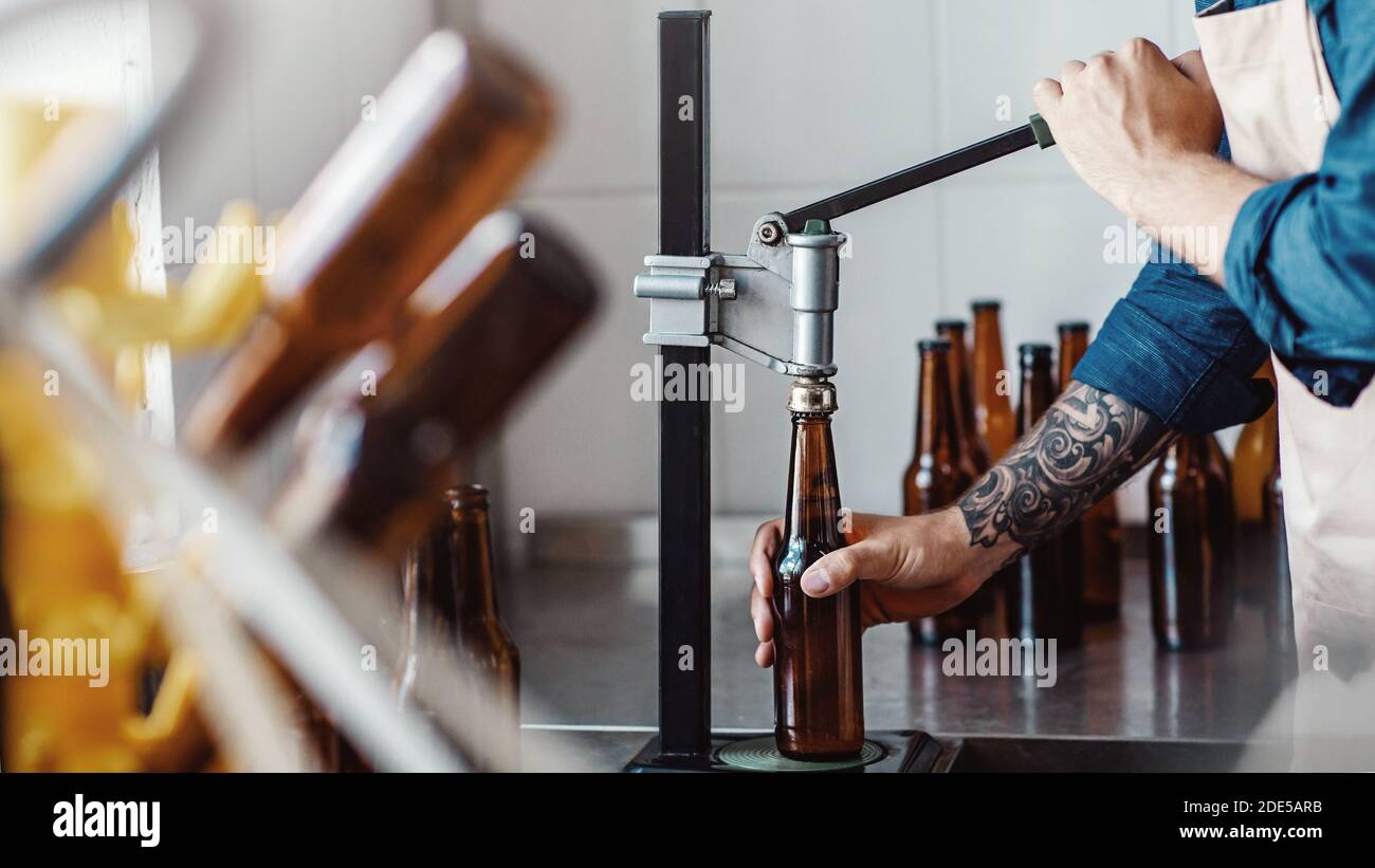 Lager bottles on modern plant, beer business, drink manufacturing and modern factory Stock Photo