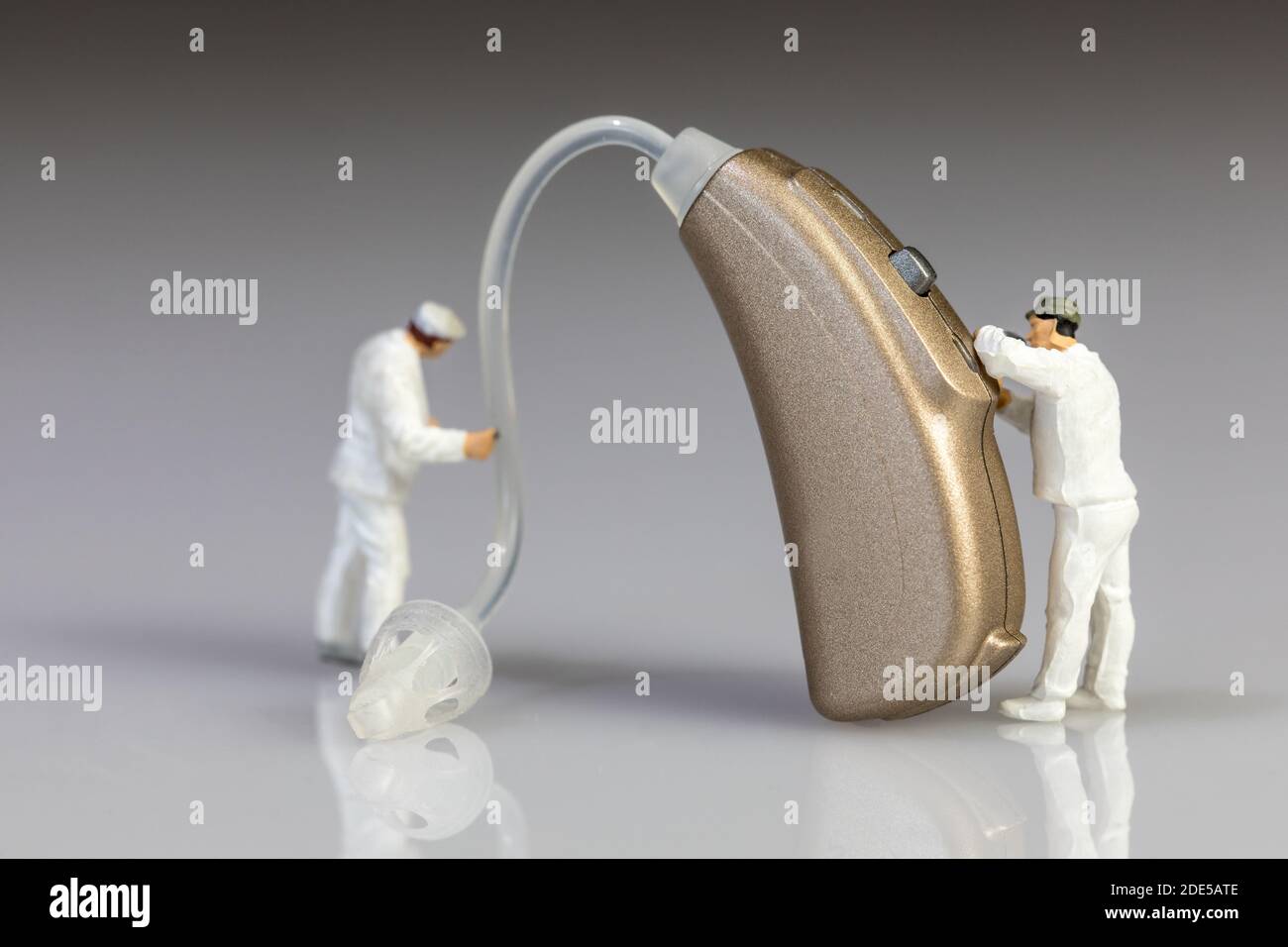 audiologists doing hearing aid maintenance Stock Photo Alamy