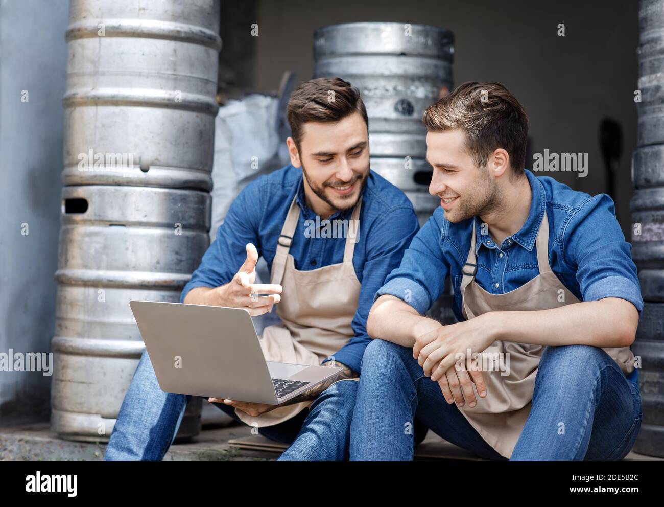 Managing modern brewery, working in warehouse and startup Stock Photo